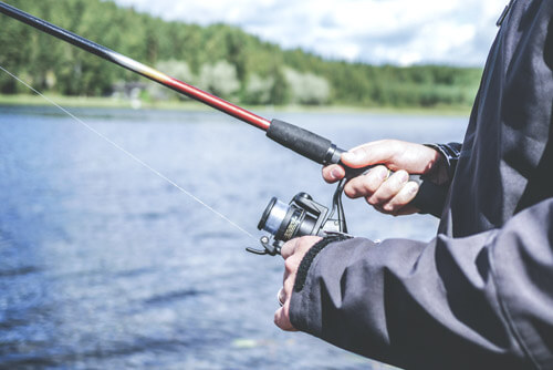 An image of a fishing captain thinking about a new charter fishing web design project. 